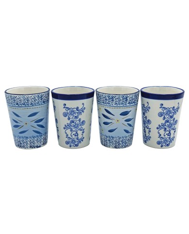 Four decorative tall tea mugs featuring intricate blue patterns on a white background, arranged side by side. Four decorative tall tea mugs featuring intricate blue patterns on a white background, arranged side by side.