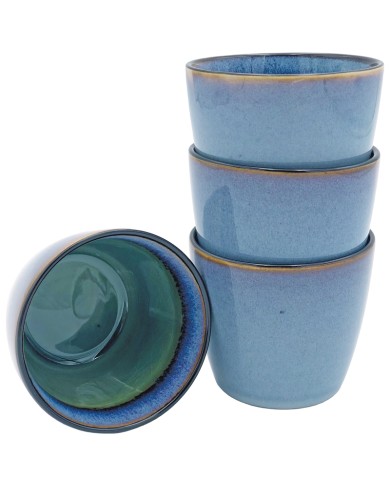 Blue cappuccino mugs stacked with one inverted to show green interior.