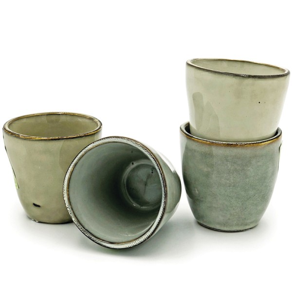 An espresso cup set of 4 ceramic cups in various shades of beige.