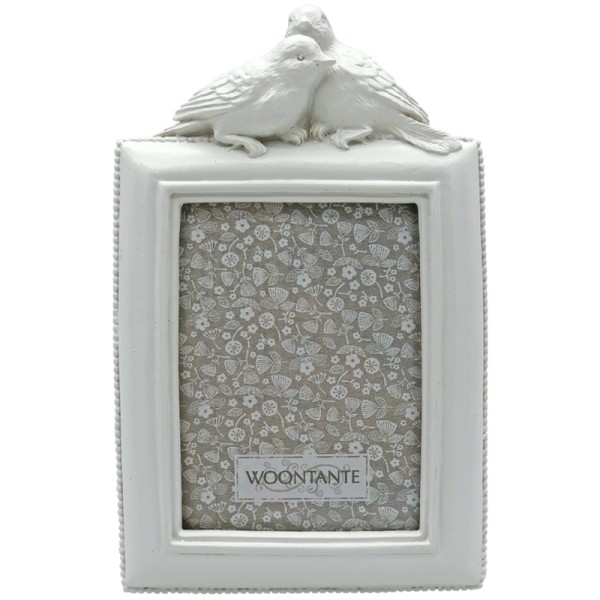 White picture frame with decorative birds on top in a vintage style.