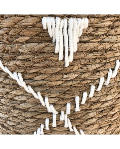 Close up of the geometric embroidery on the seagrass laundry basket. Close up of the geometric embroidery on the seagrass laundry basket.