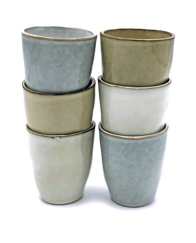 A stack of six boho coffee cups in soft, neutral tones—grey, beige, and white. A stack of six boho coffee cups in soft, neutral tones—grey, beige, and white.