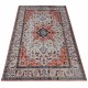 Traditional Persian rug with intricate floral patterns and a central star medallion.