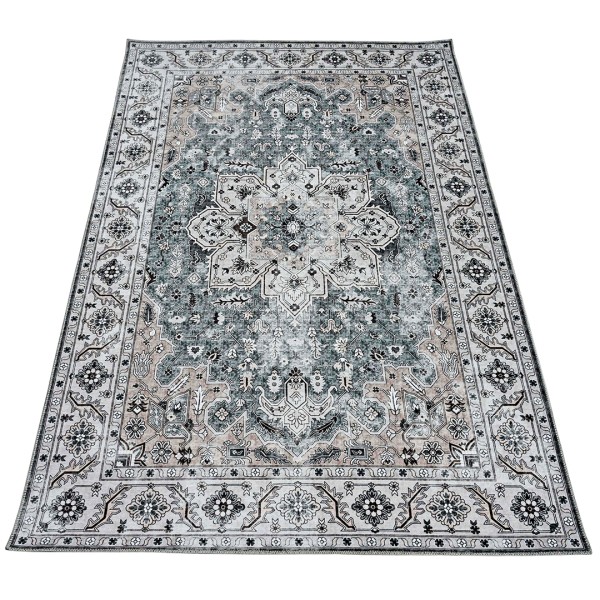 An ornate, rectangular Persian rug with intricate patterns in shades of grey and beige.