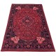 Traditional red Persian rug with intricate floral patterns and central diamond motif.