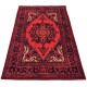 Traditional red rug in a Persian style with intricate patterns.