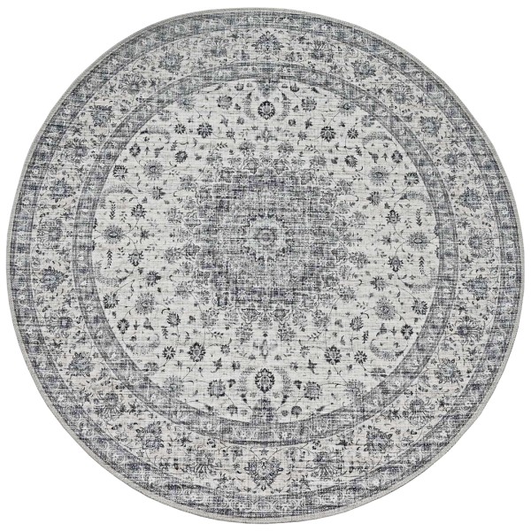 Round vintage style area rug with intricate floral patterns in shades of grey.