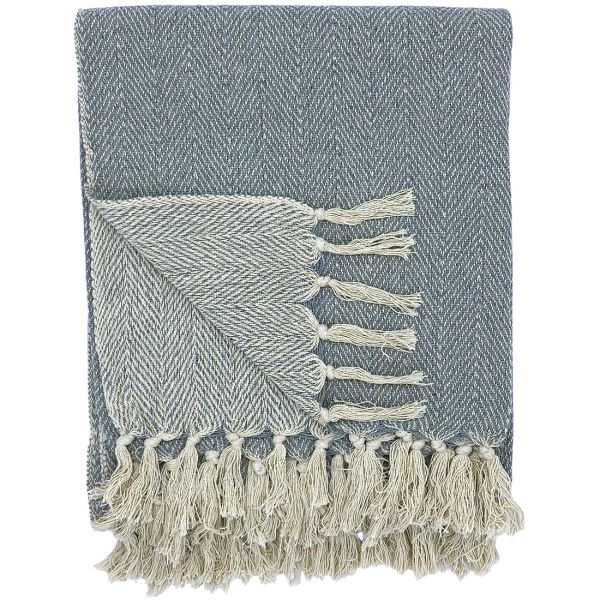 A folded grey throw blanket with a herringbone pattern and white tassels.