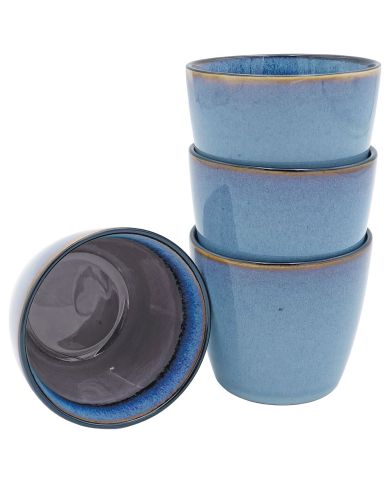 Stacked coffee mug set of four, with one cup tilted to reveal its inner purple and blue glaze pattern.