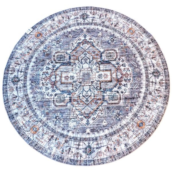 Round grey rug with intricate grey and blue patterns on a faded background.