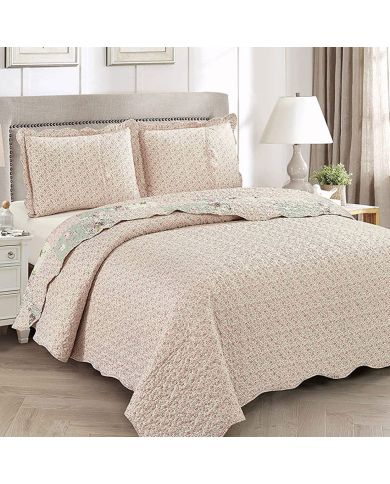 Showcasing the reverse design of the floral bedspread, a delicate rosebud print, paired with matching pillows. Showcasing the reverse design of the floral bedspread, a delicate rosebud print, paired with matching pillows.