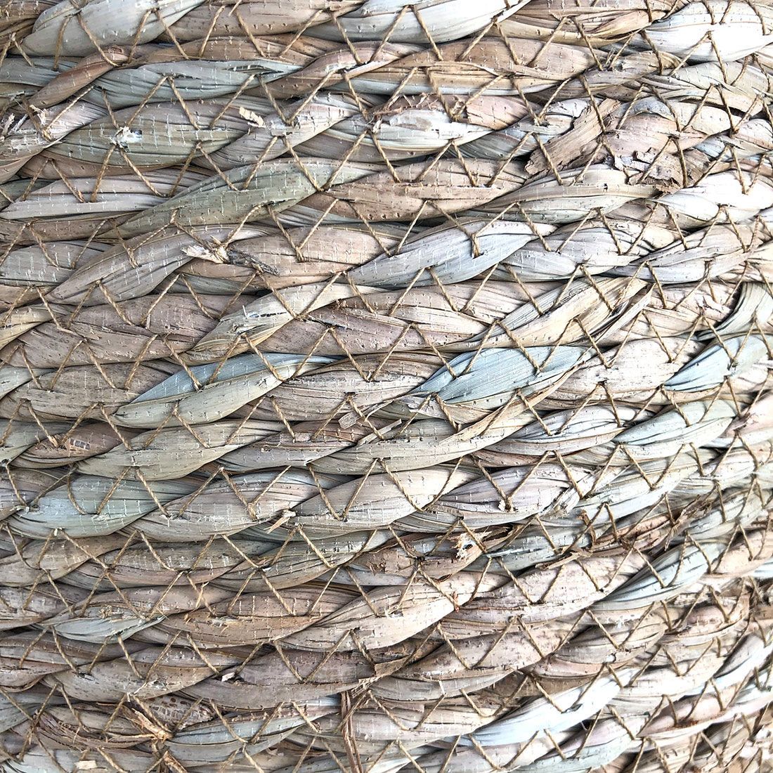Close up of the woven seagrass from a seagrass waste paper basket.