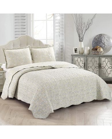 Het Floral Toile-dessin van de beige bedsprei, gecombineerd met bijpassende kussens.