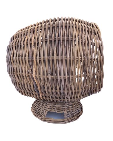 Side view of a rattan cat basket showcasing strong woven rattan. Side view of a rattan cat basket showcasing strong woven rattan.