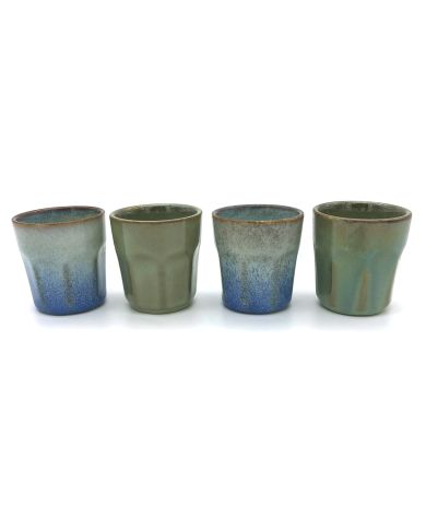 Four handmade espresso cups with subtle blue and green reactive glazes.