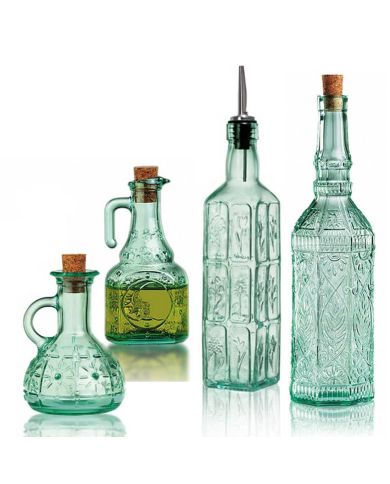 Four decorative green-tinted glass bottles with cork stoppers, in varying shapes and sizes.