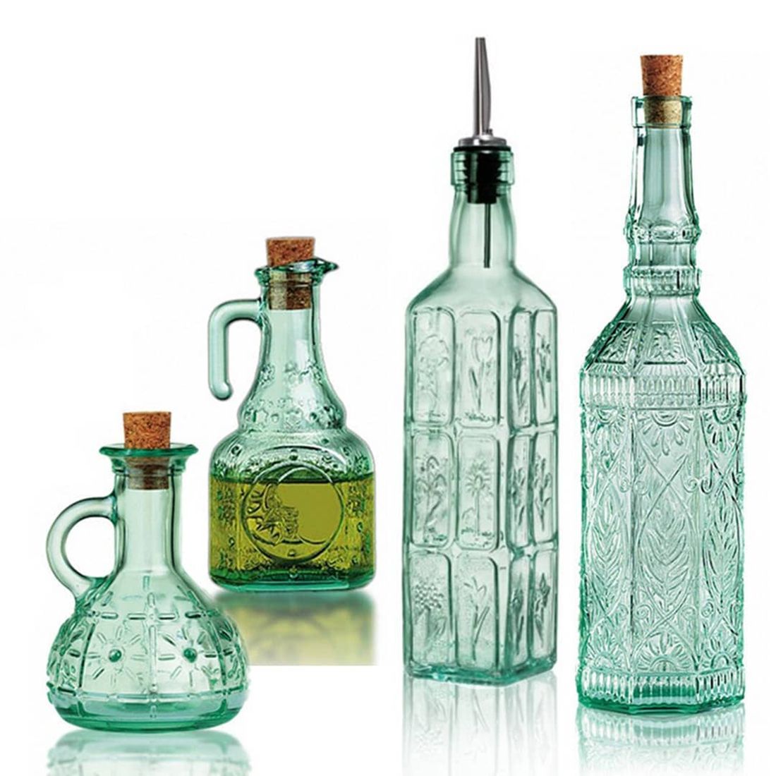 Four decorative green-tinted glass bottles with cork stoppers, in varying shapes and sizes.