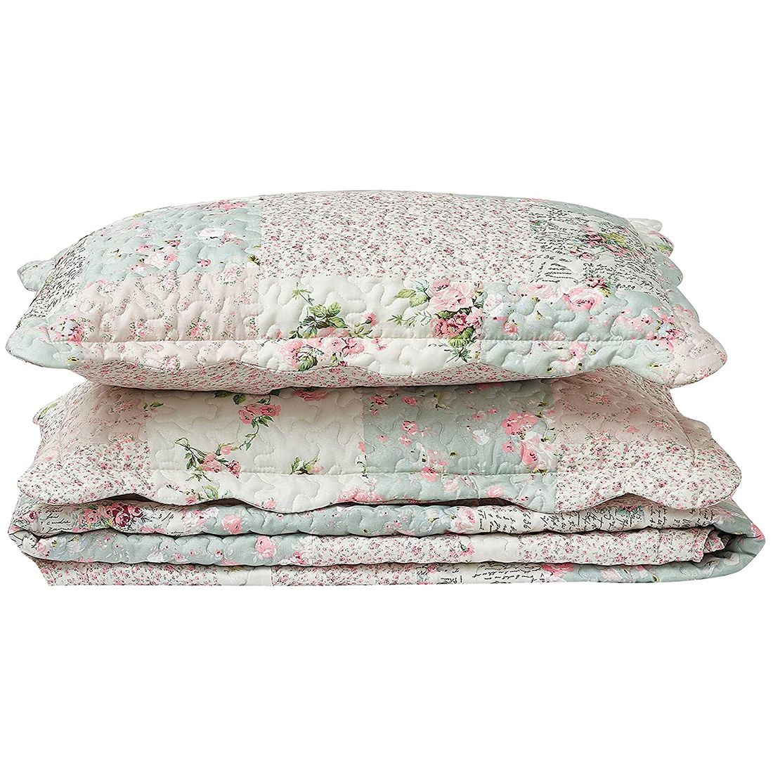 Gestapelde kussensloop groen en roze met patchwork en bloemmotieven.