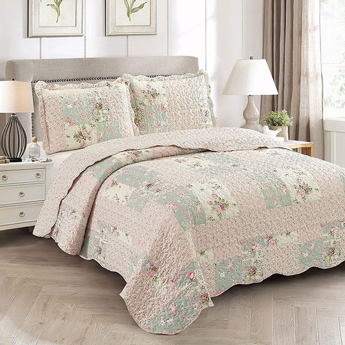 Elegant bedroom with a Rosebud floral quilt set on bed, matching pillowcases, and classic decor.