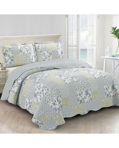 Elegant bedroom with a Sea Breeze quilt and matching pillowcase and natural light.