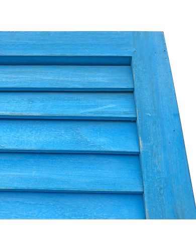 Close up of the bluewash wooden shutters highlighting the fixed slats. Close up of the bluewash wooden shutters highlighting the fixed slats.