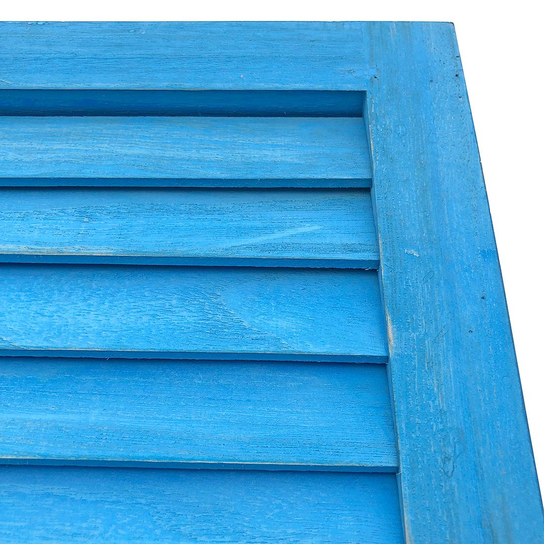 Close up of the bluewash wooden shutters highlighting the fixed slats.