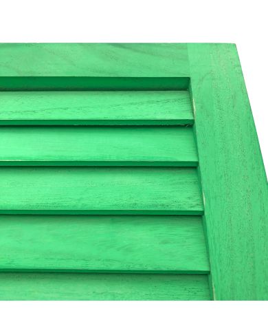 Close up of the green wooden shutters highlighting the fixed slats. Close up of the green wooden shutters highlighting the fixed slats.