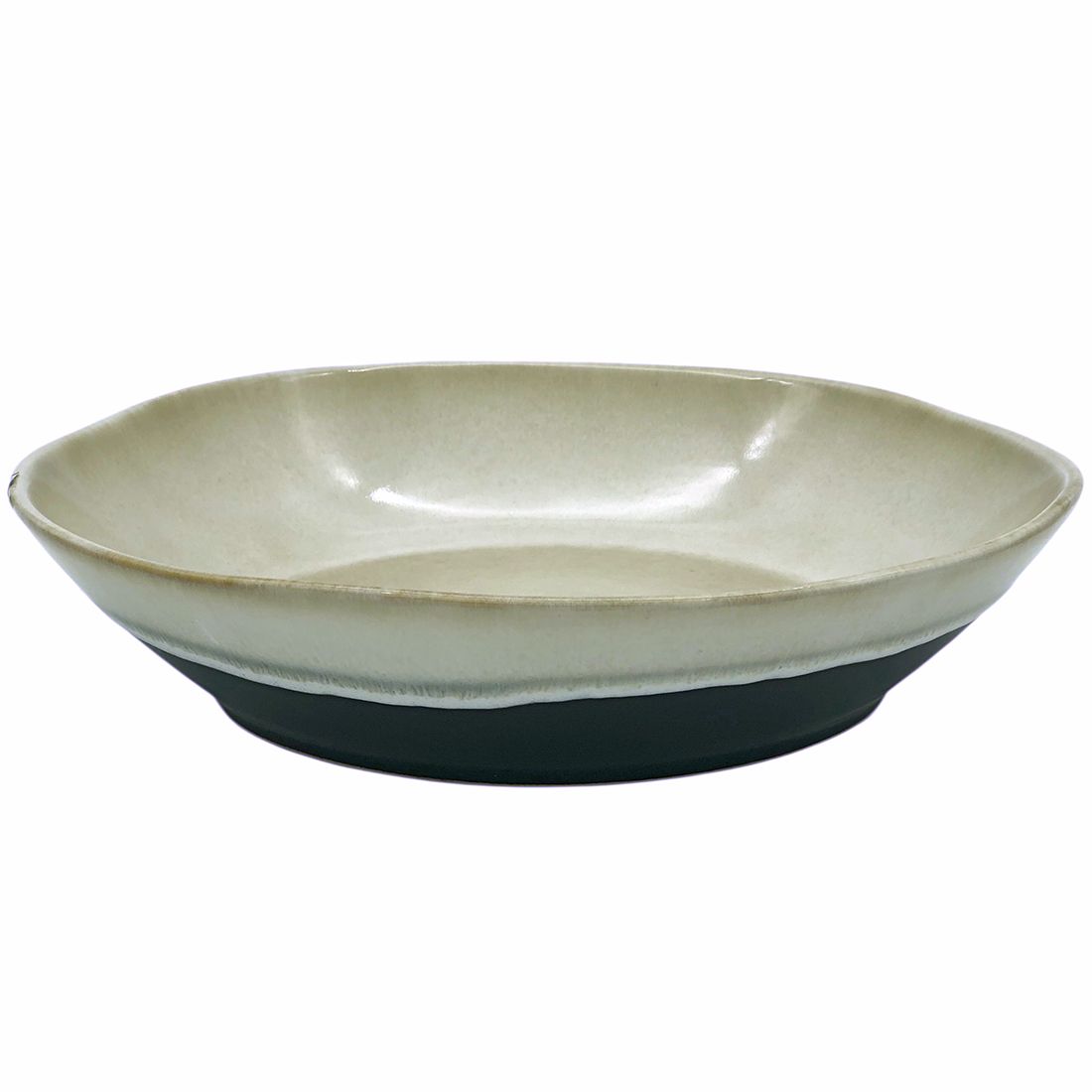 Two-tone large serving dish with a smooth beige interior and a contrasting black base.
