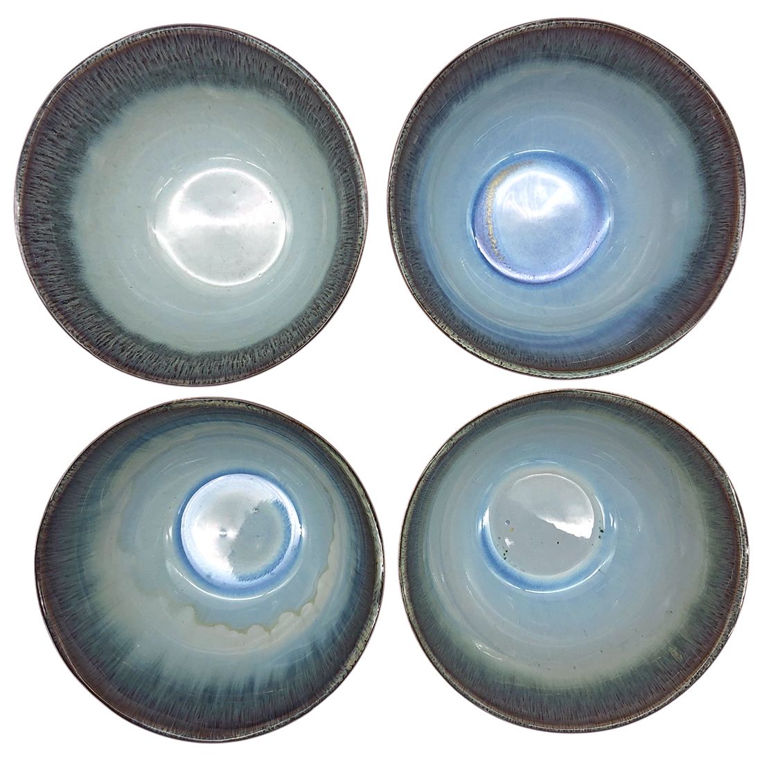 Bovenaanzicht van de keramische ramen kom als set met verschillende tinten blauw en groen aan de binnenkant. Bovenaanzicht van de keramische ramen kom als set met verschillende tinten blauw en groen aan de binnenkant.