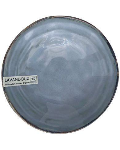 Bovenaanzicht van een van de tapas schaaltjes blauw gekleurd met een glanzende afwerking en een rustieke rand.