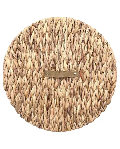 Top view of the water hyacinth laundry basket, showcasing the lid with a faux leather handle.