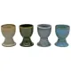 Four ceramic egg cups with a reactive glaze finish, arranged side by side. Four ceramic egg cups with a reactive glaze finish, arranged side by side.