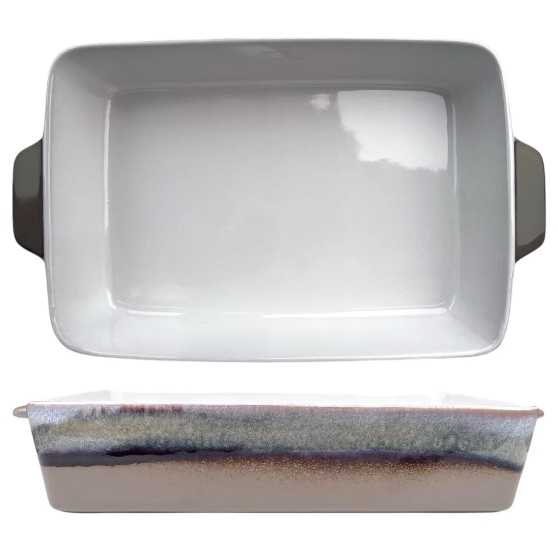 A ceramic oven dish with a glossy white interior and a reactive glaze edge, featuring two handles.