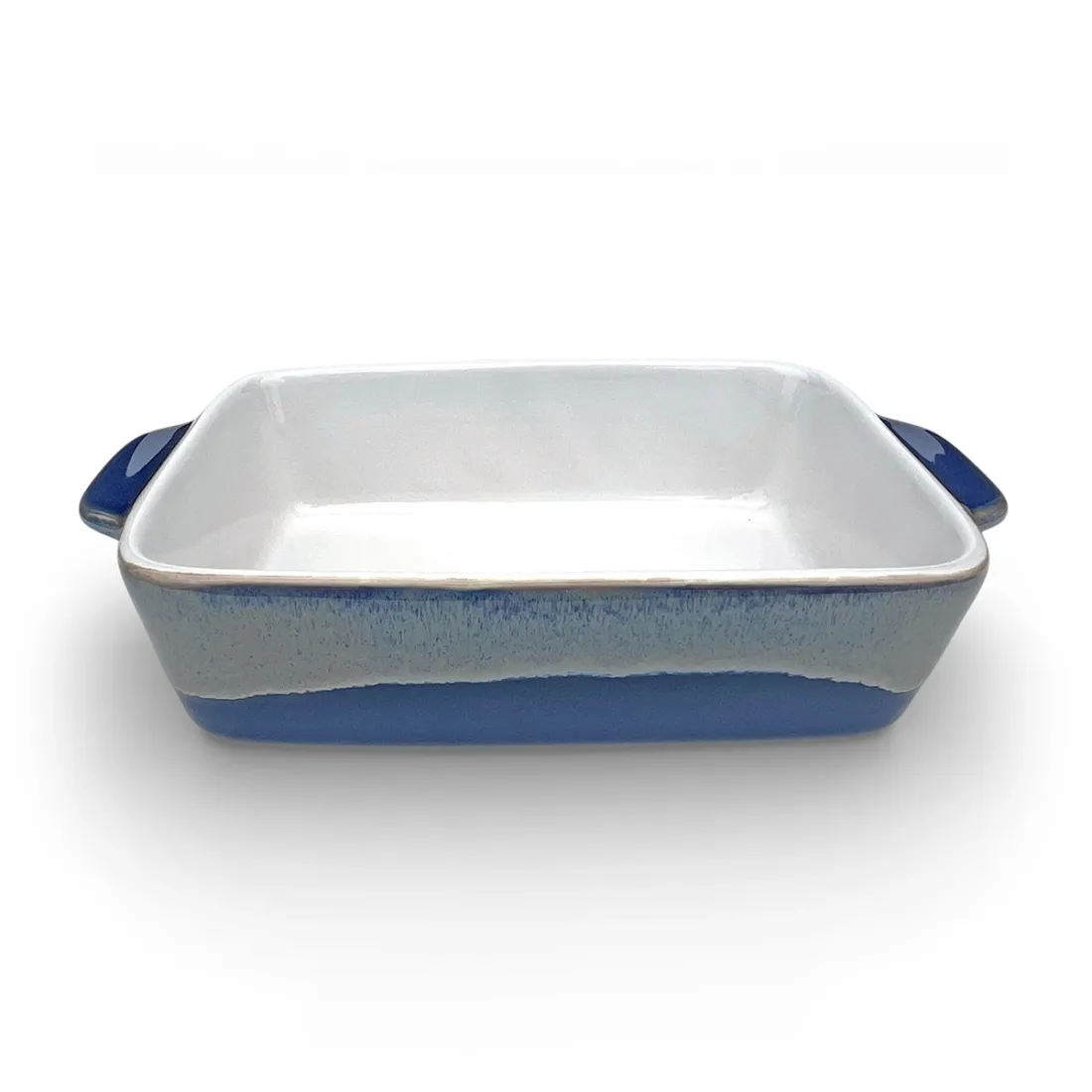 A rectangular single serve oven dish with a glossy white interior and a reactive glaze exterior.