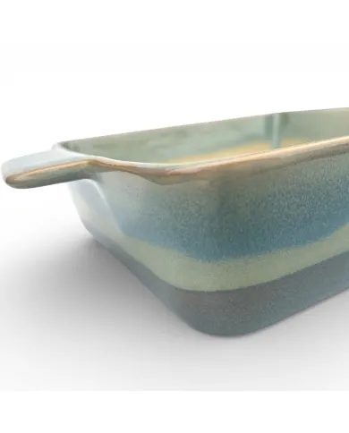 A close-up of a square oven dish high-lighting the reactive glaze finish.