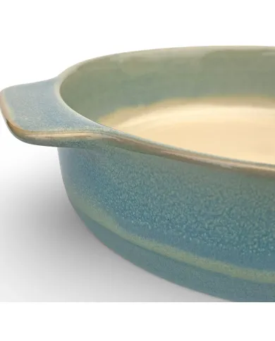 A close-up of a round oven dish high-lighting the reactive glaze finish.