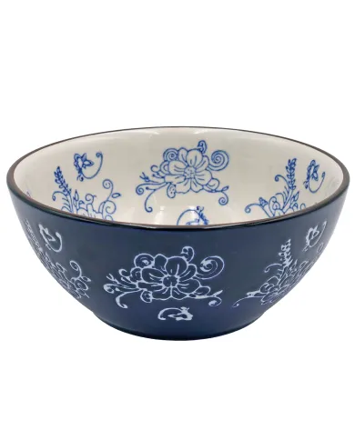 A dark blue poke bowl featuring white floral designs on its exterior and blue floral patterns inside.