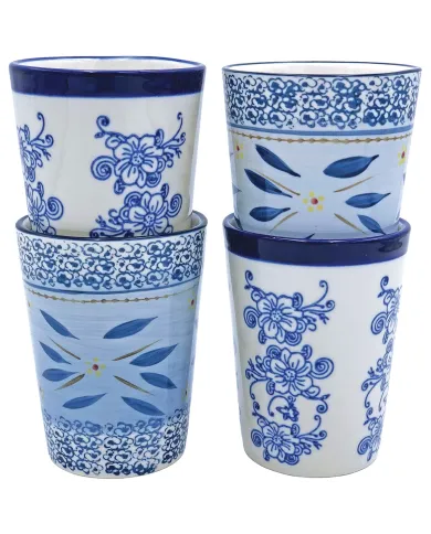 Four decorative tall tea mugs with intricate blue floral and leaf patterns stacked in two groups.