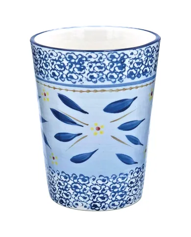 A handcrafted tall ceramic mug featuring a blue floral design and intricate border.