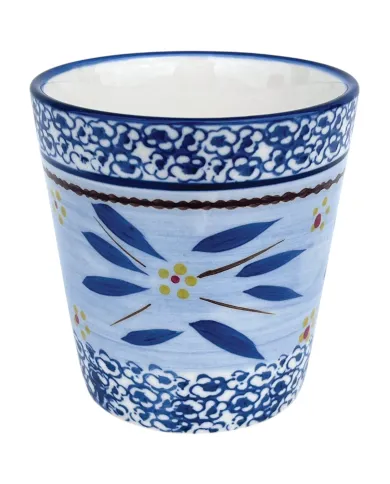 A decorative blue ceramic coffee mug featuring floral patterns and intricate designs in yellow and red accents.