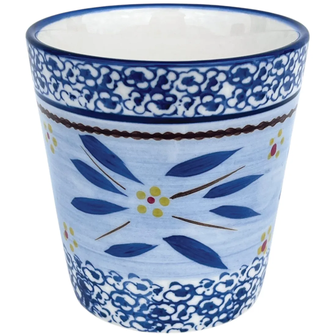 A decorative blue ceramic coffee mug featuring floral patterns and intricate designs in yellow and red accents.