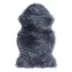 Classically shaped grey sheepskin rug made of soft and luxurious faux fur.