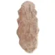 Double pelt faux sheepskin rug made of soft and luxurious beige faux fur.