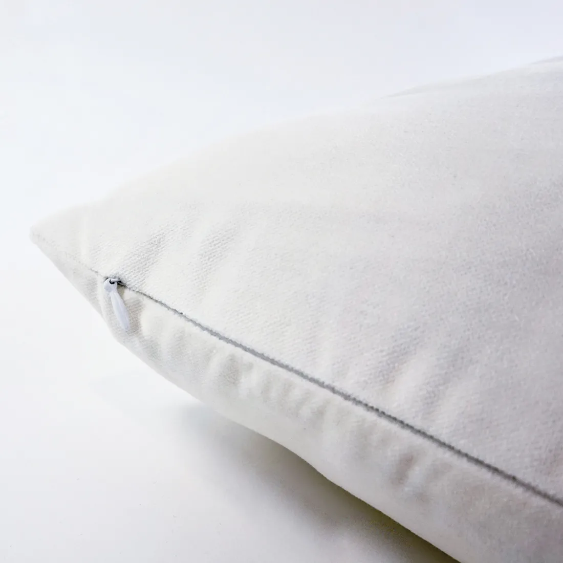 Detail of Cat Blossom cushion showing a concealed zipper.