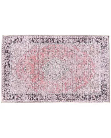 Vintage deurmat met een verweerd patroon in oranje en beige tinten.