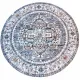 Round grey rug with intricate grey and blue patterns on a faded background.
