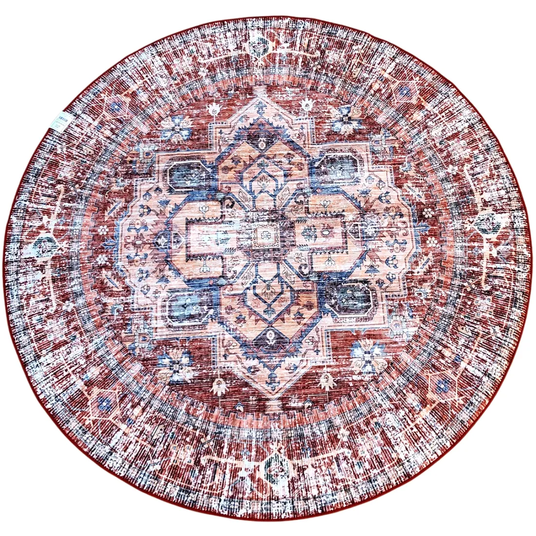 Round vintage rug with intricate blue and dark orange patterns on a neutral background.