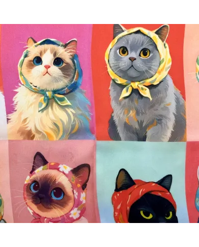 Close up of the satin scarf featuring a whimsical pattern of stylized cats.