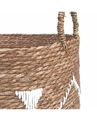 Close up of the raffia handles on the embroidered seagrass laundry basket.