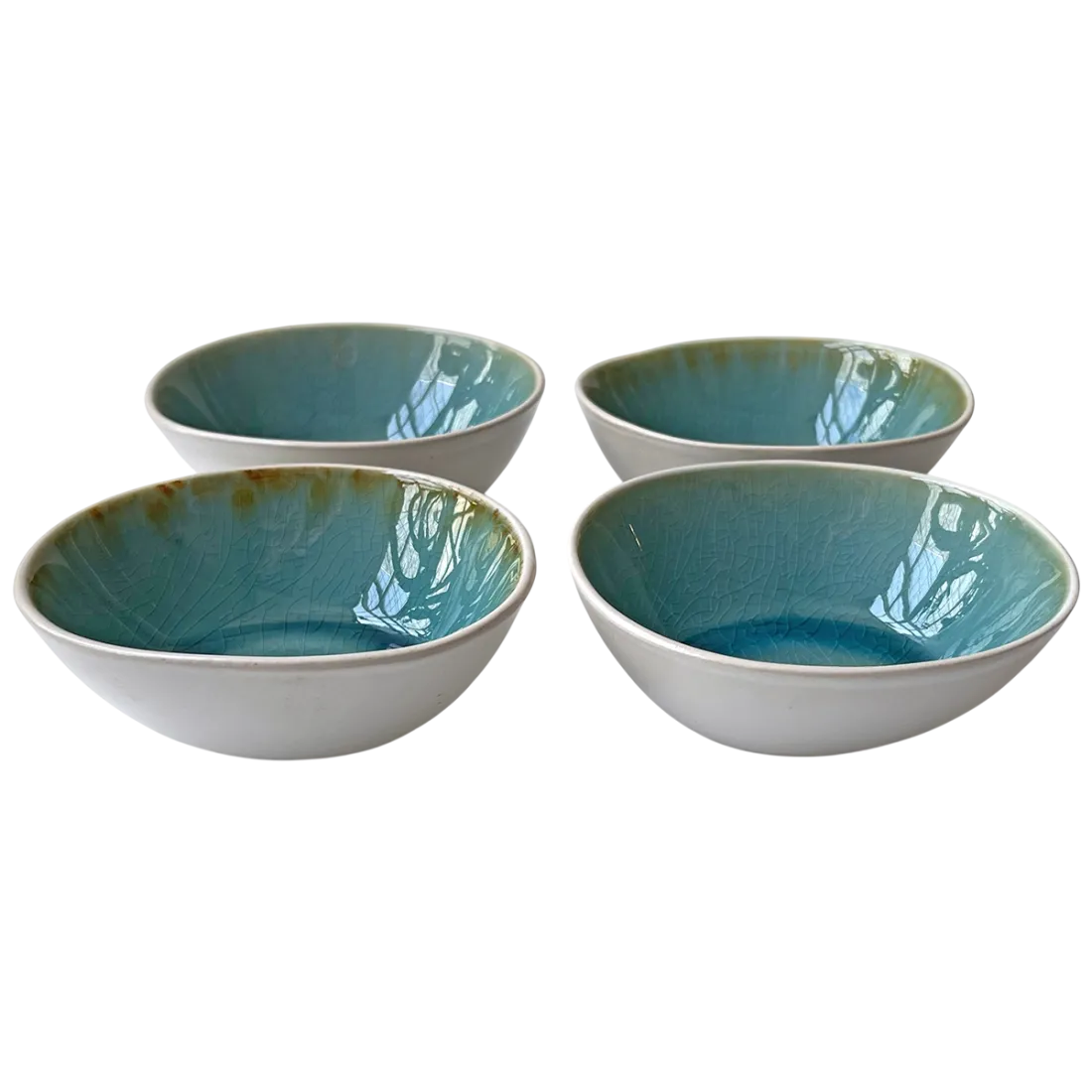 Set of four ceramic dipping bowls with white exterior and glossy, crackled turquoise interior.